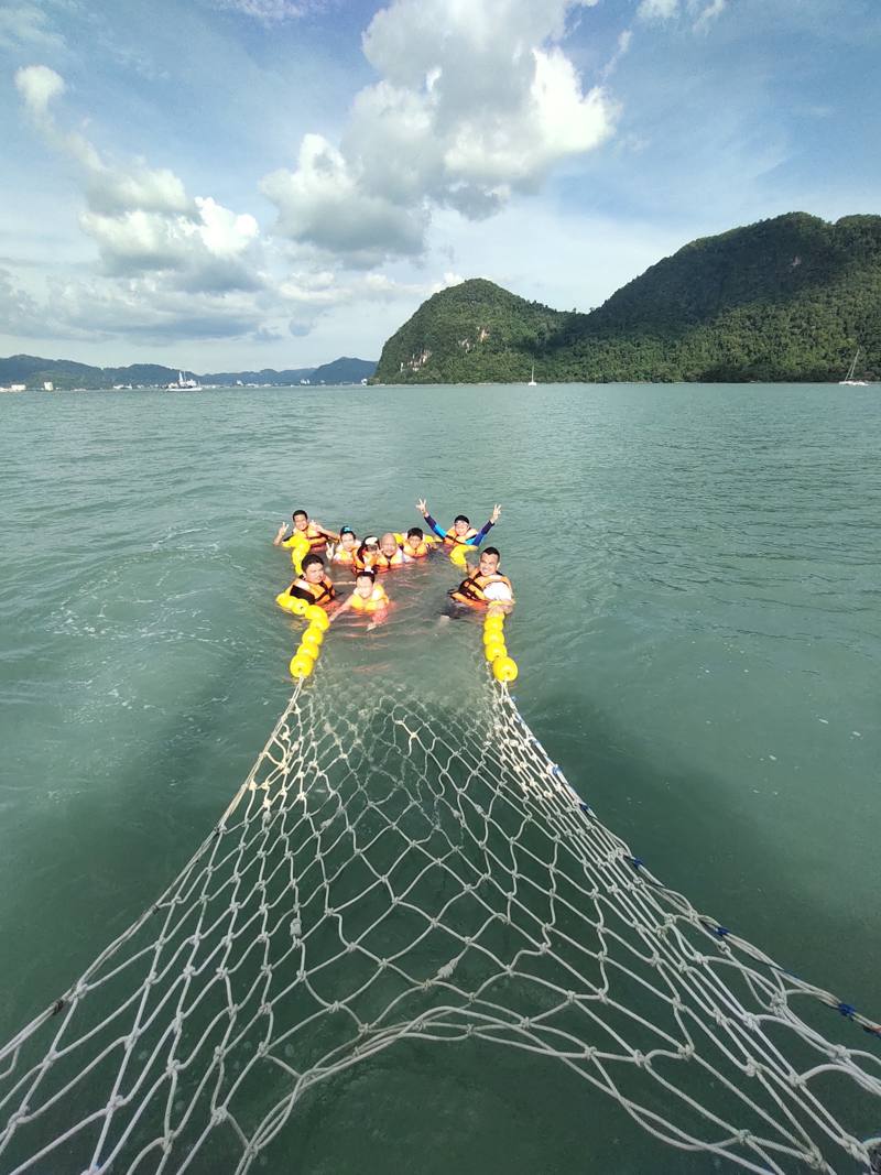 Family snorkelling and swimming