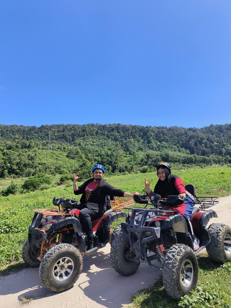 Couple on ATVs